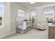 Charming Bedroom with a cozy crib and comfortable seating at 40 Honeydew Way, Clayton, NC 27520
