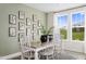 Bright dining room features stylish decor and a large window for natural light at 40 Honeydew Way, Clayton, NC 27520