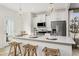 Modern kitchen features white cabinets, stainless steel appliances, and a breakfast bar at 40 Honeydew Way, Clayton, NC 27520