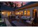 Backyard patio featuring a dining table, seating, outdoor grill, and direct access to the pool and spa at 403 Granville Rd, Chapel Hill, NC 27514