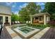 Stunning backyard with a luxurious pool, spa, and a cozy outdoor cabana at 403 Granville Rd, Chapel Hill, NC 27514