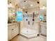 Bathroom featuring a glass enclosed shower, granite countertops, and white custom cabinetry at 403 Granville Rd, Chapel Hill, NC 27514