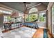 Bonus room with a vaulted ceiling, large windows, hardwood floors, and a table tennis set at 403 Granville Rd, Chapel Hill, NC 27514