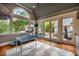 Bonus room boasts a vaulted ceiling, large windows, wood floors, and access to the outdoor pool at 403 Granville Rd, Chapel Hill, NC 27514