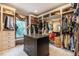 Spacious walk-in closet featuring custom shelving, drawers, and ample storage space for clothes and accessories at 403 Granville Rd, Chapel Hill, NC 27514