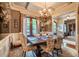 Elegant dining room with coffered ceilings, chandelier, and french doors to outdoor space at 403 Granville Rd, Chapel Hill, NC 27514