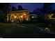 Stately home exterior showcasing manicured lawn, elegant columns, and inviting entrance at night at 403 Granville Rd, Chapel Hill, NC 27514