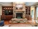 Detailed shot of the living room stone fireplace with built-in shelves and hardwood floors at 403 Granville Rd, Chapel Hill, NC 27514