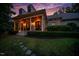 Impressive home featuring a stately front porch with columns and a well-maintained lawn and garden at 403 Granville Rd, Chapel Hill, NC 27514
