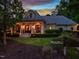 Charming home exterior showcasing a covered front porch with stately columns and manicured landscaping at 403 Granville Rd, Chapel Hill, NC 27514