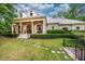 Charming exterior with a large front porch, white columns, and beautiful landscaping at 403 Granville Rd, Chapel Hill, NC 27514