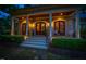Inviting front porch with classic columns and seating area, perfect for enjoying the outdoors at 403 Granville Rd, Chapel Hill, NC 27514