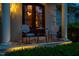 Inviting front porch with classic chairs and warm lighting, perfect for relaxing evenings at 403 Granville Rd, Chapel Hill, NC 27514