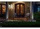 Inviting front porch with brickwork, columns, and chairs, creating a cozy and welcoming entrance at 403 Granville Rd, Chapel Hill, NC 27514