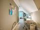 Hallway leading to an office space with a desk, chair, and a bed with soft carpet at 403 Granville Rd, Chapel Hill, NC 27514
