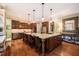 Gourmet kitchen with large island, granite countertops, and stainless steel appliances at 403 Granville Rd, Chapel Hill, NC 27514