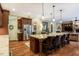 Bright kitchen featuring a huge island with marble countertop, dark wood cabinets and stainless appliances at 403 Granville Rd, Chapel Hill, NC 27514