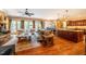 Spacious living room with a stone fireplace, open to the kitchen and breakfast nook at 403 Granville Rd, Chapel Hill, NC 27514