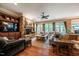Spacious living room with stone fireplace, built-in shelves, and lots of natural light at 403 Granville Rd, Chapel Hill, NC 27514
