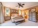 Cozy bedroom features neutral walls, bedside tables, upholstered bench, and an adjoining bathroom at 403 Granville Rd, Chapel Hill, NC 27514