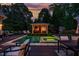 Backyard pool and hot tub with an outdoor cabana, a perfect spot for relaxation and entertaining at 403 Granville Rd, Chapel Hill, NC 27514