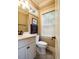 Elegant powder room featuring marble vanity, stylish fixtures, and natural light at 403 Granville Rd, Chapel Hill, NC 27514