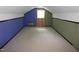 Attic space with wood panels, neutral carpet and a window at 4113 Oak Park Rd, Raleigh, NC 27612