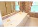 Bathroom with double sink vanity, decorative wallpaper, tile floor, and glass shower at 4113 Oak Park Rd, Raleigh, NC 27612