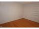 An airy bedroom featuring hardwood floors and a light-filled window at 4113 Oak Park Rd, Raleigh, NC 27612
