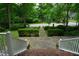 View from the front porch looking out onto the beautifully landscaped yard and neighborhood at 4113 Oak Park Rd, Raleigh, NC 27612