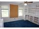 Home office with built-in bookshelves, carpet and two windows at 4113 Oak Park Rd, Raleigh, NC 27612