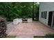 An outdoor kitchen featuring a built-in grill and countertop space on a brick patio at 4113 Oak Park Rd, Raleigh, NC 27612
