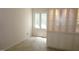 A room with light walls and floors, a window overlooking the backyard, and built-in cabinetry for ample storage at 4113 Oak Park Rd, Raleigh, NC 27612