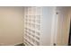 Wall of shelving and a door leading to another storage area or room at 4113 Oak Park Rd, Raleigh, NC 27612