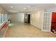 Spacious sunroom with tile flooring, built-in seating, cabinets, display cabinets and multiple windows for abundant natural light at 4113 Oak Park Rd, Raleigh, NC 27612
