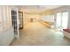 Spacious sunroom with tile flooring, cabinets, display cabinets, built-in seating, and many windows for natural light at 4113 Oak Park Rd, Raleigh, NC 27612