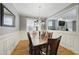 Dining room featuring wood floors, traditional wood table and chairs at 420 Marsh Landing Dr, Holly Springs, NC 27540