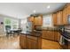 Well-lit kitchen featuring stainless steel appliances, island and a breakfast nook at 420 Marsh Landing Dr, Holly Springs, NC 27540