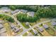 Expansive aerial view of homes surrounded by lush greenery, offering a serene neighborhood setting at 4221 Northrop Dr, Haw River, NC 27258