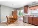 Bright dining area with wood floors, table, and sliding glass doors to the outdoor patio at 4221 Northrop Dr, Haw River, NC 27258