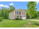 Beautiful home with a well-manicured lawn, lovely landscaping and a two car garage at 4221 Northrop Dr, Haw River, NC 27258