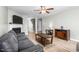 Comfortable living room features a fireplace, hardwood floors, and staircase access at 4221 Northrop Dr, Haw River, NC 27258