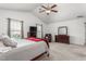 Bright main bedroom with vaulted ceilings, plush carpet, and a comfortable seating area at 4221 Northrop Dr, Haw River, NC 27258