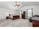 Spacious main bedroom with vaulted ceilings, carpet, and two windows providing natural light at 4221 Northrop Dr, Haw River, NC 27258