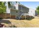 Backyard featuring deck, mature trees and partial fence at 4309 Birmingham Way, Raleigh, NC 27604