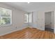 Bedroom with natural light, hardwood floors and a built in bookshelf at 4309 Birmingham Way, Raleigh, NC 27604
