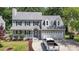 Charming two-story home featuring a well-manicured lawn, two-car garage, and welcoming front porch at 4309 Birmingham Way, Raleigh, NC 27604