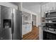 Modern kitchen featuring a stainless steel refrigerator, microwave, and oven at 4309 Birmingham Way, Raleigh, NC 27604