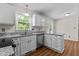 Kitchen with white cabinets, granite countertops, and stainless steel appliances at 4309 Birmingham Way, Raleigh, NC 27604