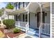Close up on the porch, showing detail of the railing and front door at 4309 Birmingham Way, Raleigh, NC 27604
